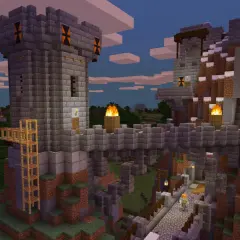 Kamienna twierdza w Minecraft, zbudowana na zboczu góry. Widać wieże, mosty, pochodnie i wodospad. Gra wymaga kreatywności!