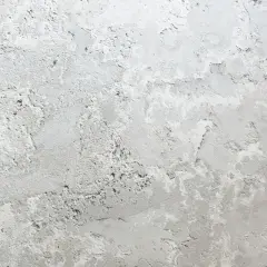 Textura de pared con manchas grises y blancas, como si fueran manchas en pared después de pintar.