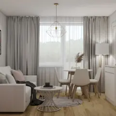 Przytulny mały salon ze stołem i wypoczynkiem. Jasna kanapa, okrągły stolik i cztery krzesła tworzą idealne miejsce do relaksu.