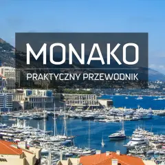 Widok na port w Monako z licznymi jachtami i budynkami na tle wzgórz.