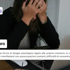 Woman with hands on head in front of a laptop, with text overlay about work anxiety.