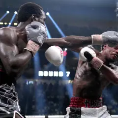 Boxer lands a powerful punch, showcasing one of the best shadow boxing finishers. The crowd roars as Round 7 begins.
