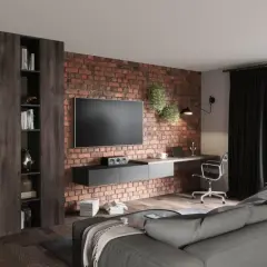 Nowocześnie urządzony salon z ceglaną ścianą, wiszącym TV, biurkiem i wygodną kanapą. Inspiracja, jak urządzić salon nowocześnie.