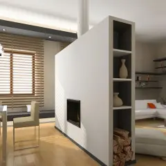 Particolare divisori in cartongesso con camino integrato e vani a giorno per libri e decorazioni.