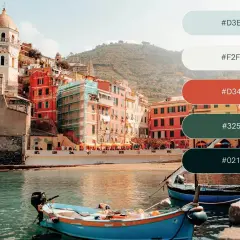 A vibrant Italian coastal town with colorful buildings and boats, showcasing a perfect vacation color palette of blues, reds, and greens.