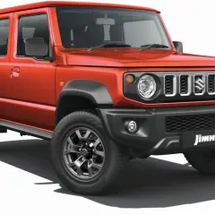 Pomarańczowy Suzuki Jimny 5-drzwiowy, idealny na przygody. Sprawdź jego cenę i możliwości!