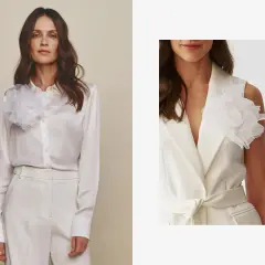 Elegancka kobieta w białej satynowej koszuli i marynarce bez rękawów, obie ozdobione białą broszką w kształcie kwiatu. Inspiracja, jak nosić broszki.