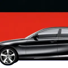 Czarny sedan na tle flagi Niemiec.