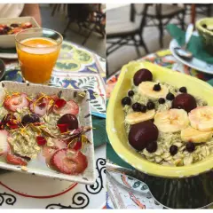 Zwei Schalen mit leckerem Matcha Porridge, garniert mit Erdbeeren, Kirschen und Bananenscheiben. Ein gesunder Start in den Tag!