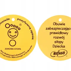 Żółty certyfikat "Zdrowa Stopa" z symbolem uśmiechniętej stopy i napisem "Obuwie zabezpieczające prawidłowy rozwój stopy Dziecka".
