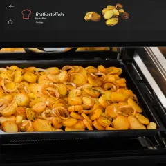 Bratkartoffeln mit Zwiebeln garen im Ofen. So funktioniert ein Ofen: Ober-/Unterhitze für knusprige Kartoffeln.