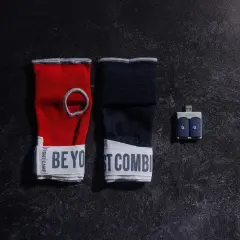 Red and navy hand wraps with "BE YOUR BEST COMBAT" text, and a USB sensor for a boxing match train.