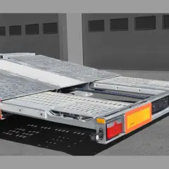 Ein roter Kässbohrer Autotransporter mit ausziehbarer Ladefläche, bereit für den Transport.