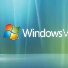 Logo Windows Vista, poprzednik systemu Windows, na tle błękitno-zielonych fal.