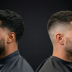 Deux hommes, deux styles de coupe homme nom. L'un avec une barbe fournie et des cheveux texturés, l'autre avec un dégradé net et une barbe courte.