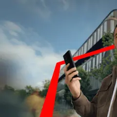 Zlatan Ibrahimović z telefonem w ręku, na tle nowoczesnego budynku i czerwonej linii symbolizującej wzrost. XTB rekomendacje.