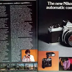 A vintage Nikon FE camera with a Nikkor lens, showcasing its classic design and advanced features for photographers.