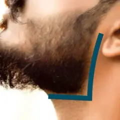 Un homme se fait tailler la joue barbe. Une ligne bleue indique la coupe parfaite.