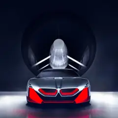 Przyszłościowy koncept BMW M9 w tunelu aerodynamicznym, z agresywnym przodem i czerwonymi akcentami.
