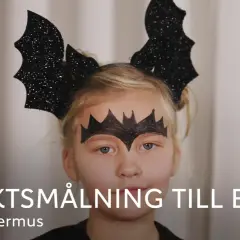 Söt fladdermus-ansiktsmålning för barn, perfekt för halloween.