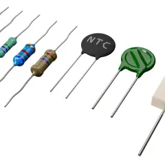 Różnorodne elementy elektroniczne: rezystory kolorowe, termistor NTC, warystor i rezystor ceramiczny.