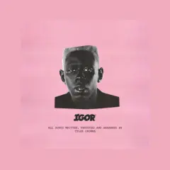 Okładka albumu "IGOR" Tylera, The Creatora. Czarno-białe zdjęcie artysty na różowym tle.