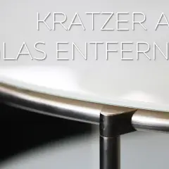 Anleitung: Kratzer im Glas entfernen. Nahaufnahme einer Glasplatte mit Metallrahmen.
