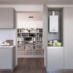 Calentador estanco blanco instalado en un armario de cocina moderno, junto a un horno.
