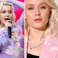 Zara Larsson, svensk popstjärna, med mikrofon och i rosa kavaj. Hennes zara larsson net worth är imponerande.