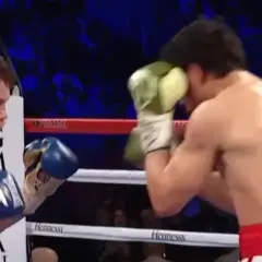 Boxers in a ring, one in a classic Mexican style boxing stance, throwing a punch.