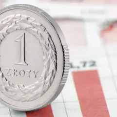 Moneta 1 złoty na tle wykresu. Czy to symbol tego, co to jest fundusz powierniczy?
