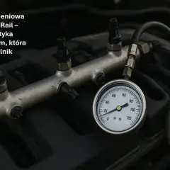 Listwa paliwowa Common Rail z podłączonym manometrem do diagnostyki, kluczowa dla zdrowia silnika.