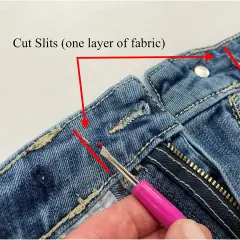 Demonstration of how to take in jeans at the waist by cutting slits in the fabric.