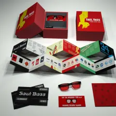 A Saul Bass designs kit, featuring a box with glasses, a folded booklet showcasing his iconic work, and cards.