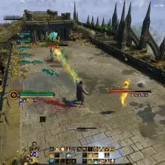 Gracze walczą z potworem w grze typu najlepsze gry mmorpg. Widać paski zdrowia, umiejętności i czat.