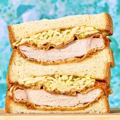 A delicious sando stacked high with crispy fried chicken and creamy coleslaw.