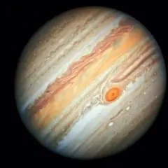 Jupiter, den femte planeten från solen, med sina virvlande molnband och den ikoniska Röda Fläcken.