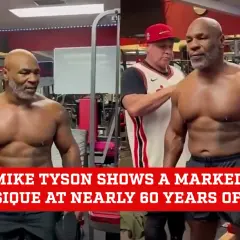 Mike Tyson's impressive physique at nearly 60 years old is on full display in a gym setting. His muscular build shows his continued dedication to fitness.