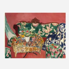 A vibrant interior scene by Matisse, capturing the joy of life with a floral sofa, patterned tablecloth, and a vase of flowers.