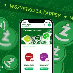 Grafika przedstawia smartfon z aplikacją Żappka, monety z logo Ż i promocje.