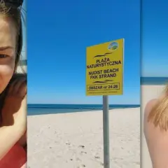 Uśmiechnięta kobieta na plaży nudystów. Obok tablica informująca o obszarze.