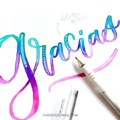 Hermosos ejemplos de lettering con la palabra "Gracias" en acuarela degradada, con detalles en blanco y un bolígrafo.
