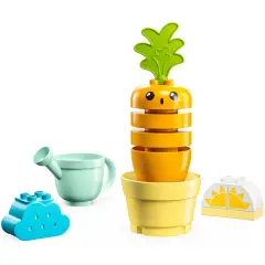 Zestaw z zabawkami: uśmiechnięta lego duplo marchewka w doniczce, niebieska chmurka, konewka i słońce.