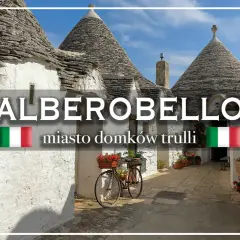 Urokliwe domki trulli w Alberobello, Włochy. Rower z kwiatami czeka na przejażdżkę po urokliwych uliczkach.