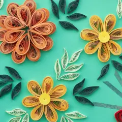 Kwiaty z papieru wykonane techniką quilling krok po kroku. Delikatne ozdoby z papierowych pasków tworzą barwne kompozycje.