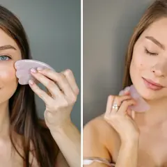 Kvinna använder en rosa gua sha för ansiktsmassage.