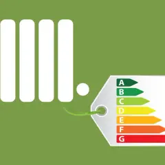 Radiador blanco con etiqueta de eficiencia energética. Aprende a programar calefacción para ahorrar.