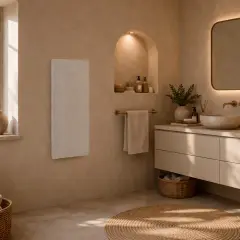 Baño moderno con lavabos dobles, espejo iluminado y radiador blanco. El calculo calefaccion es clave para este ambiente acogedor.