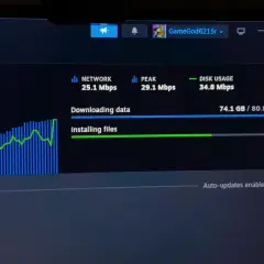 Monitorowanie pobierania na Steam, aby sprawdzić, jak przyśpieszyć pobieranie. Widoczny wykres sieci i postęp instalacji.