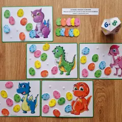 Zabawa edukacyjna na dzień dinozaura w przedszkolu: kolorowe jajka do przyklejania na planszach z dinozaurami.